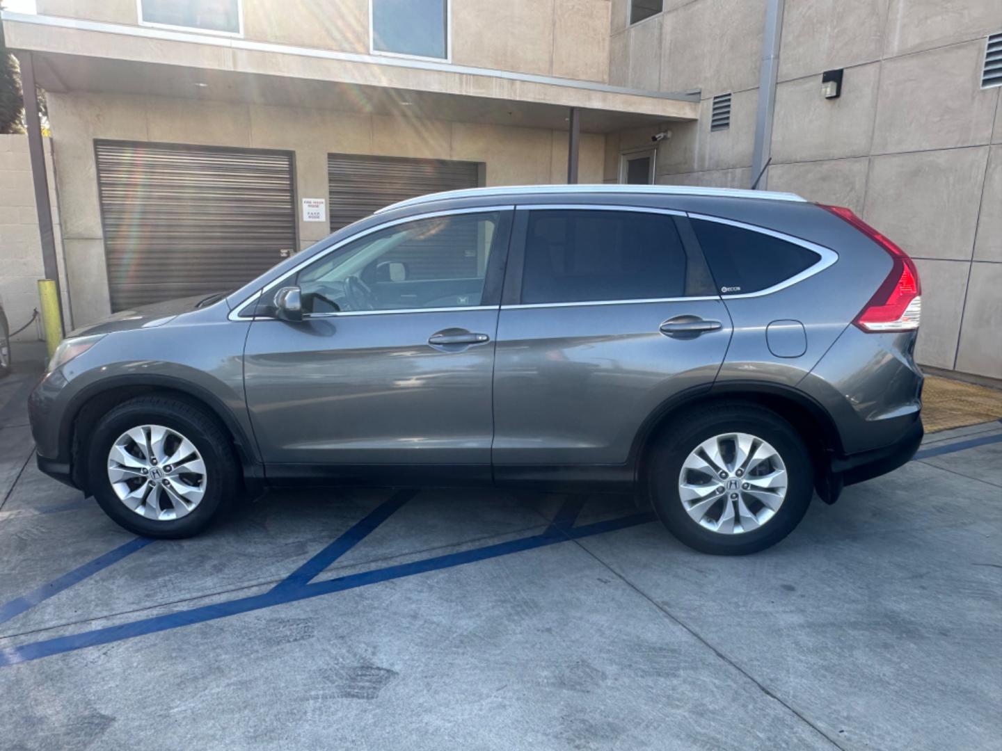 2012 Grey /Gray Honda CR-V EX-L 2WD 5-Speed AT (JHLRM3H78CC) with an 2.4L L4 DOHC 16V engine, 5-Speed Automatic transmission, located at 30 S. Berkeley Avenue, Pasadena, CA, 91107, (626) 248-7567, 34.145447, -118.109398 - Moon-roof! Leather seats! This 2012 Honda CR-V EX-L 2WD 5-Speed AT looks and drives good. - Photo#1